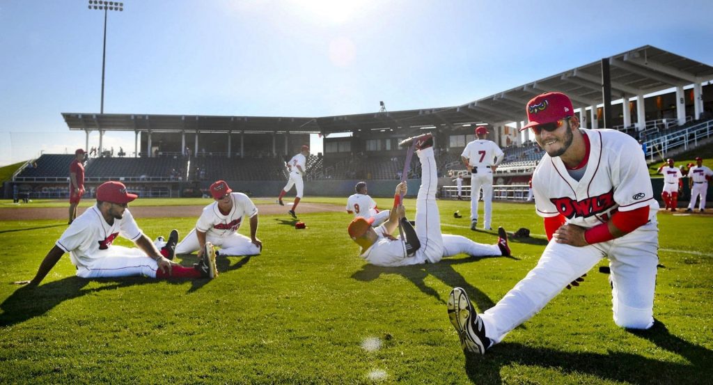Players at UCCU Ballpark, architectural design by Elliott Workgroup