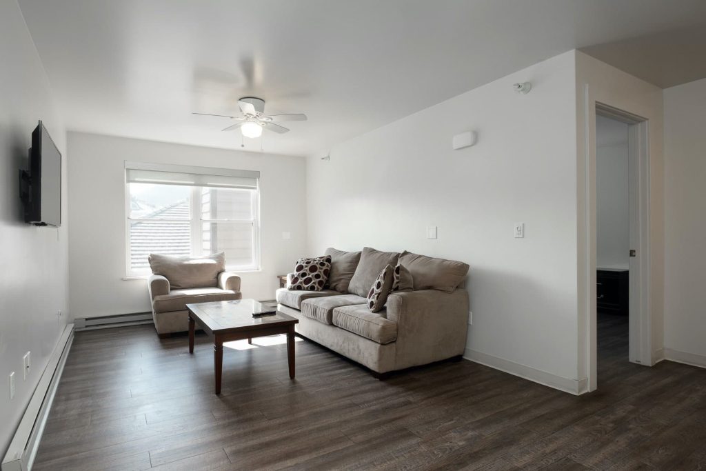 Living room, Empire Avenue Workforce Housing, architectural design by Elliott Workgroup